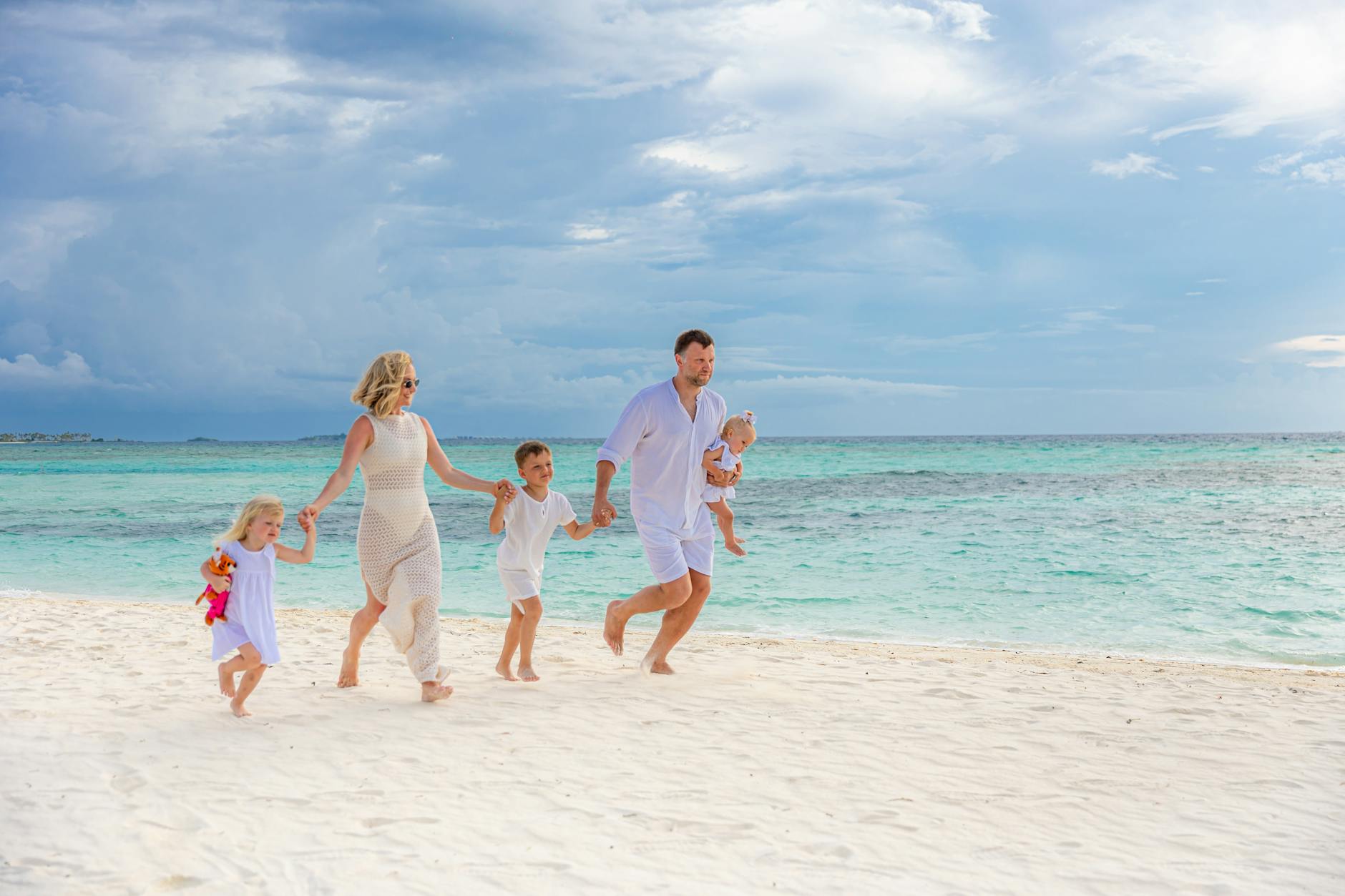 family enjoying a sunny day at the beach