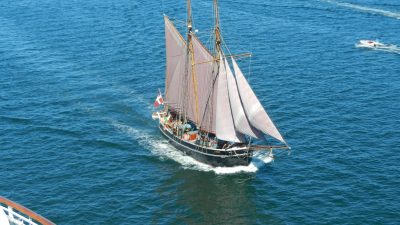 sailing ship on open blue sea adventure