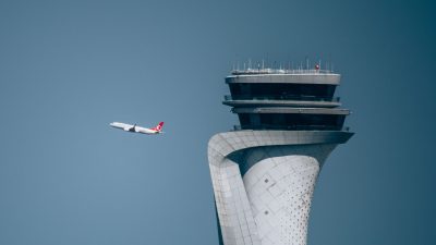 turkish airlines plane with istanbul airport tower