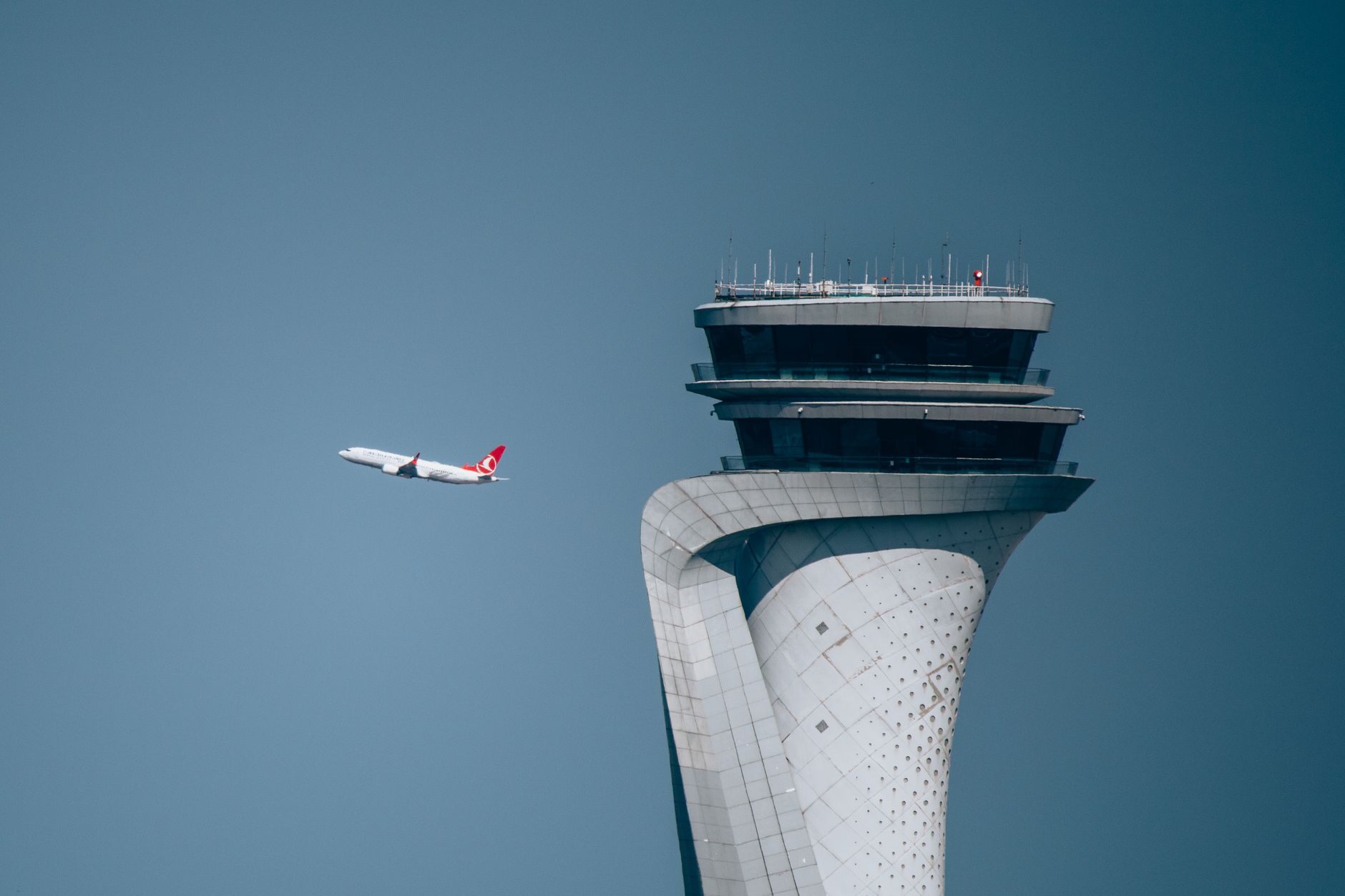 turkish airlines plane with istanbul airport tower