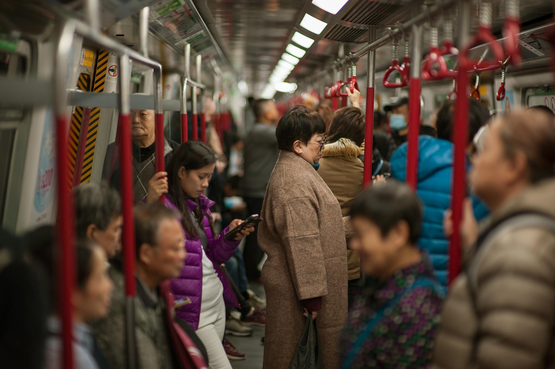 busy commuters in hong kong island subway