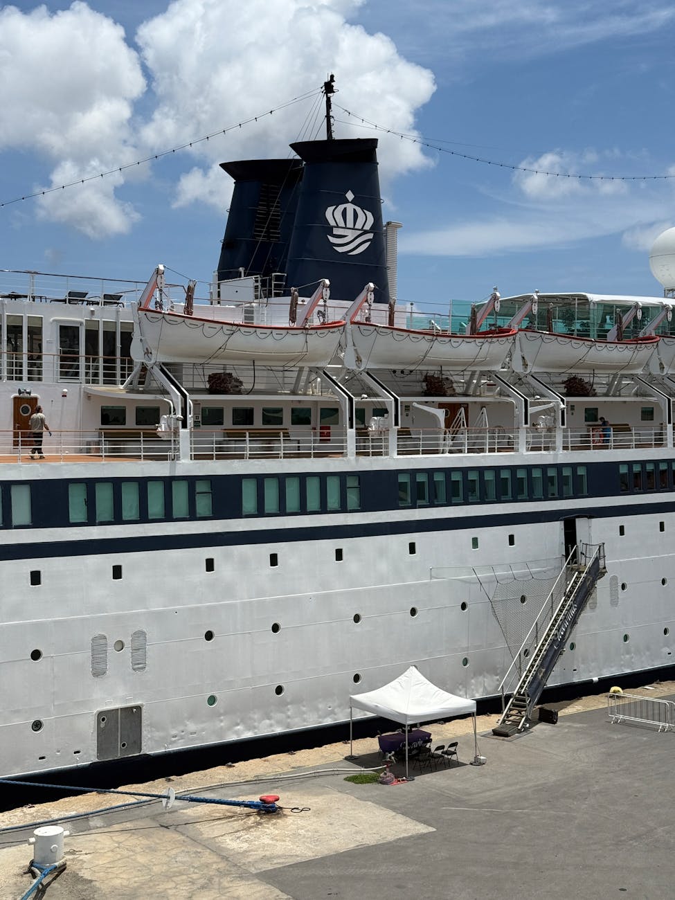 cruise ship docked in aruba on a clear day