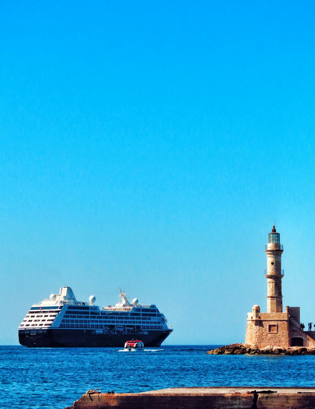cruise ship passing chania s historic lighthouse