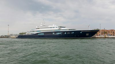 luxurious yacht docked at scenic waterfront