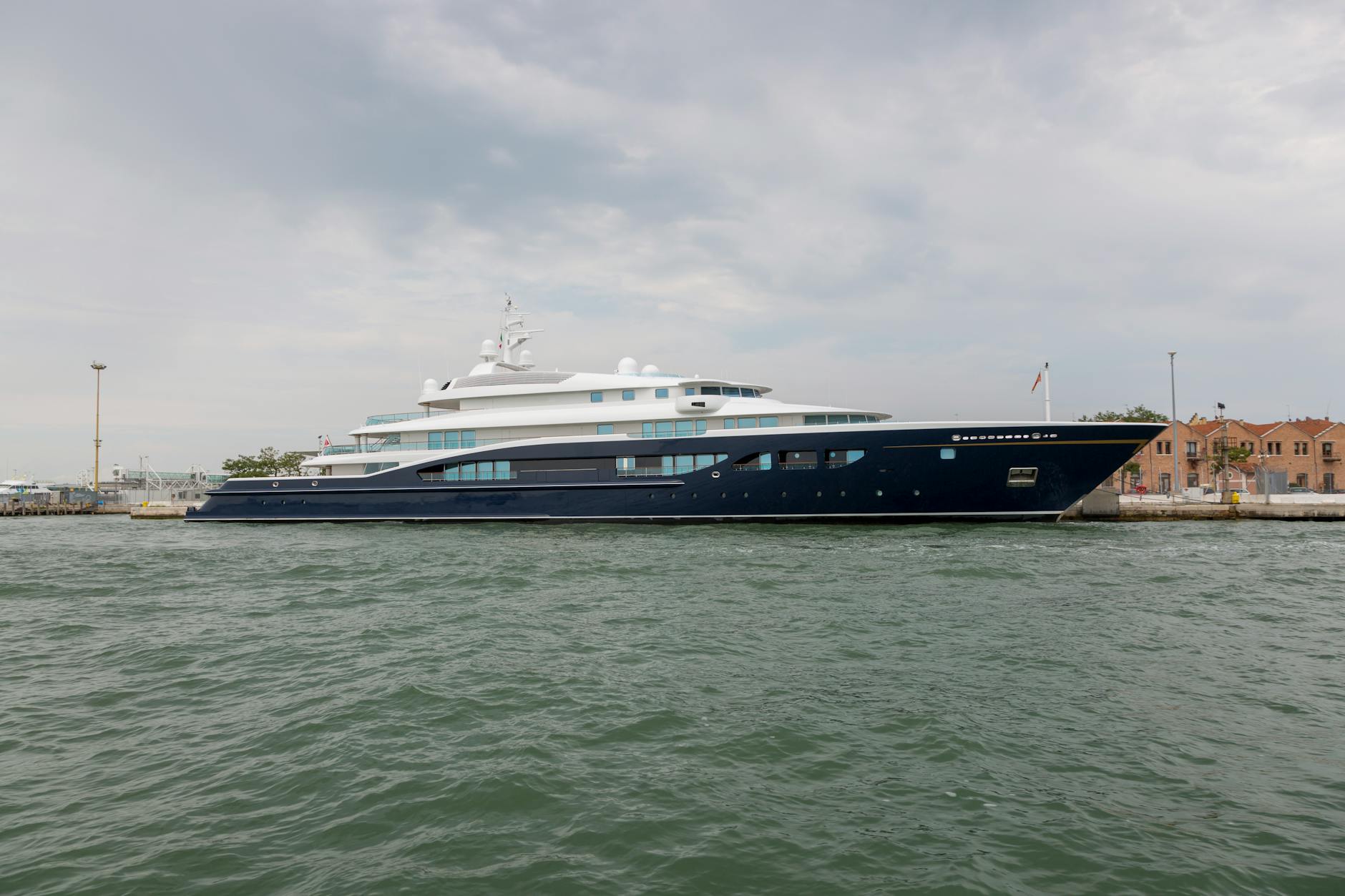 luxurious yacht docked at scenic waterfront