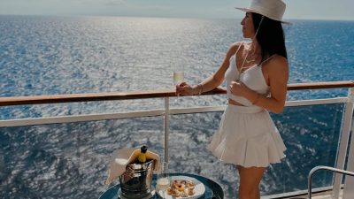 woman enjoying ocean view from cruise deck