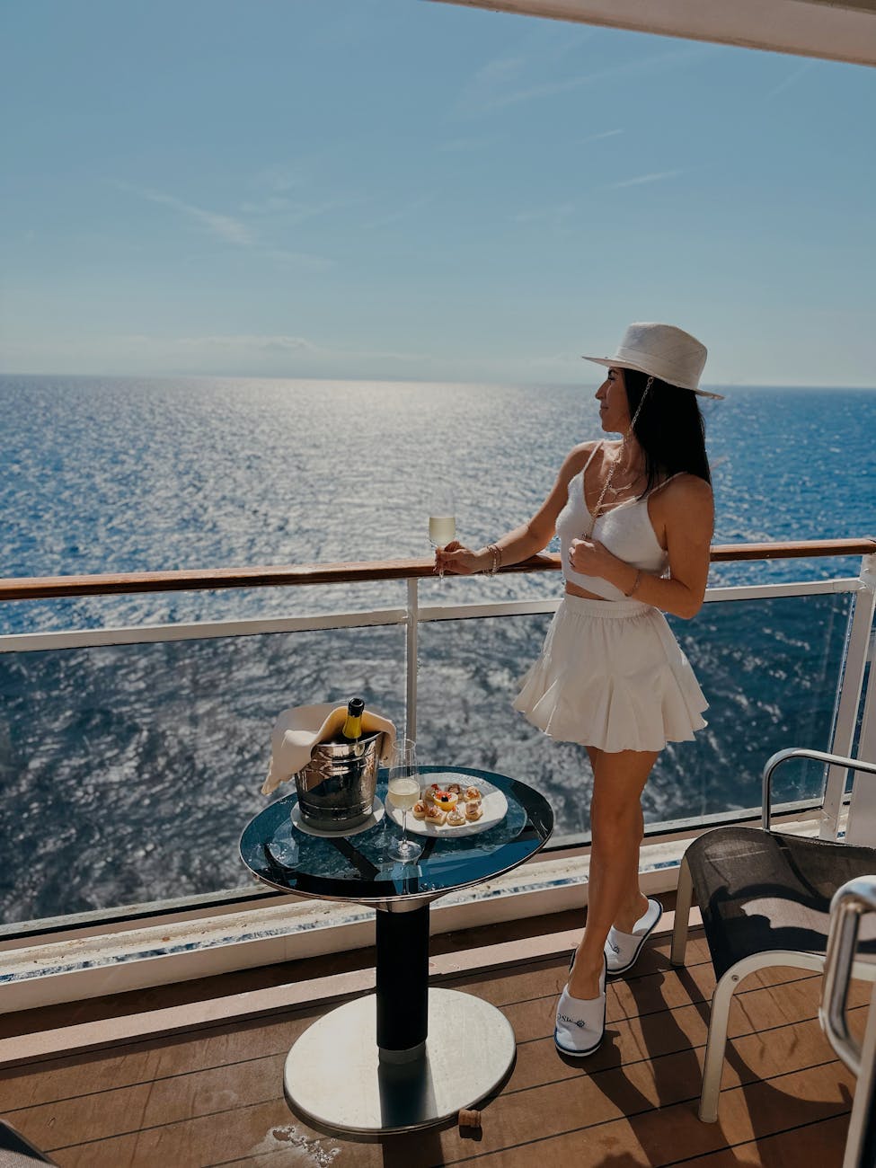 woman enjoying ocean view from cruise deck