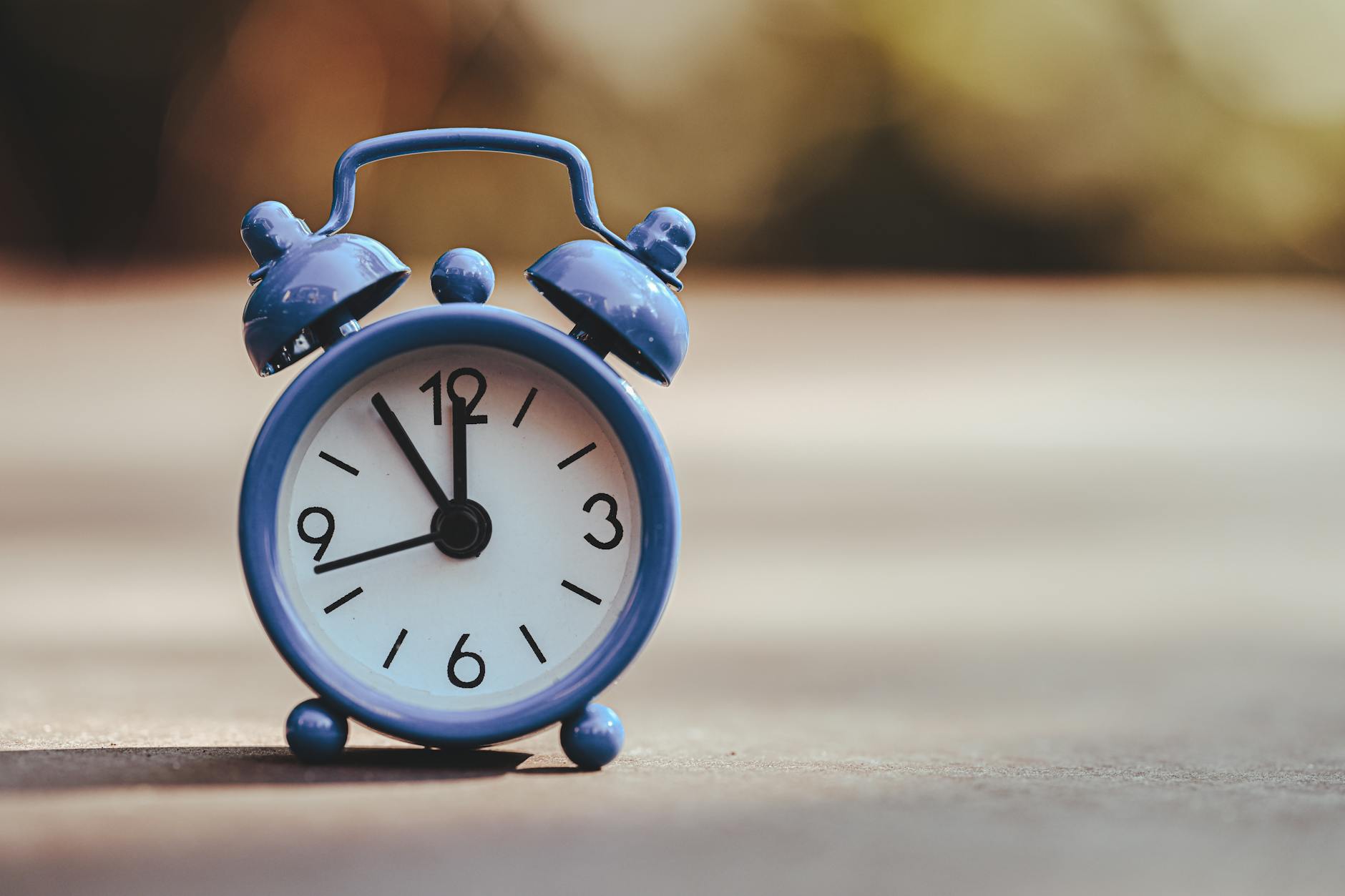 classic blue alarm clock at dawn