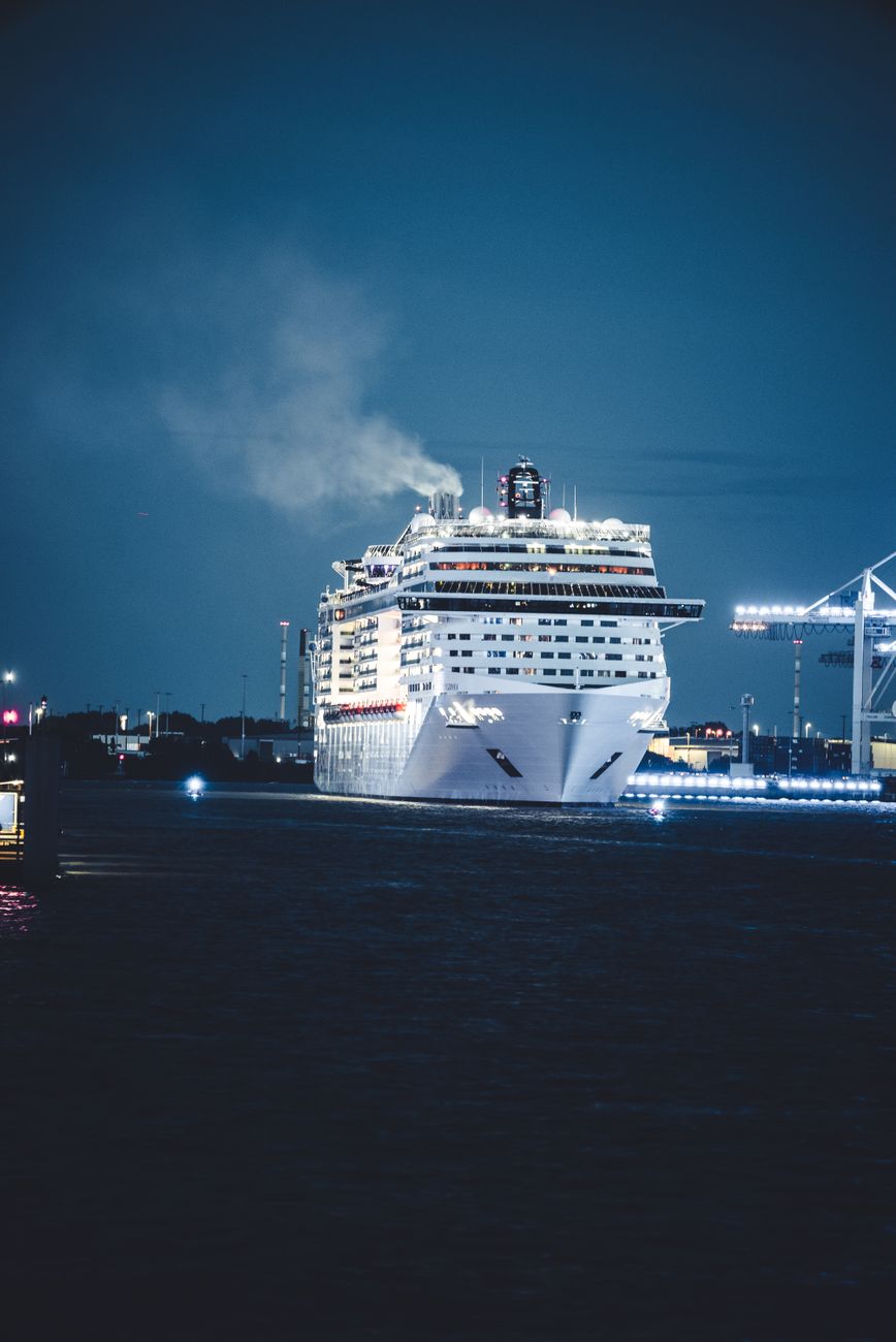 majestic cruise ship in night harbor scene