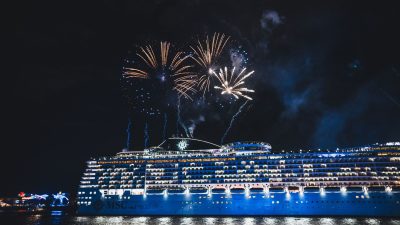 fireworks illuminate cruise ship at night