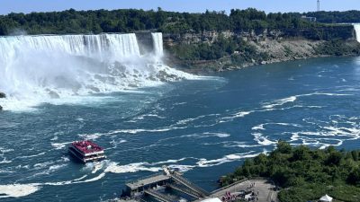 aerial view of niagara falls with tour boat