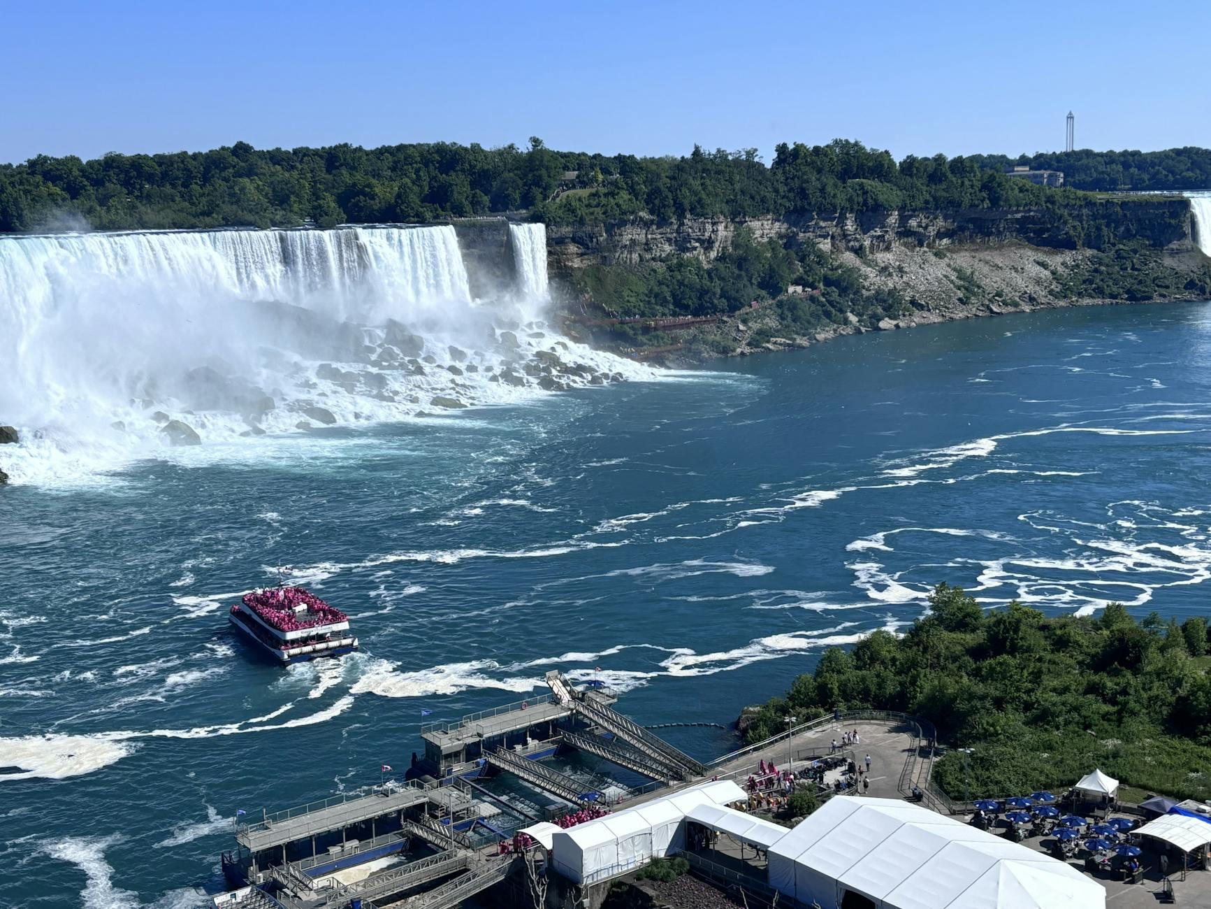 aerial view of niagara falls with tour boat