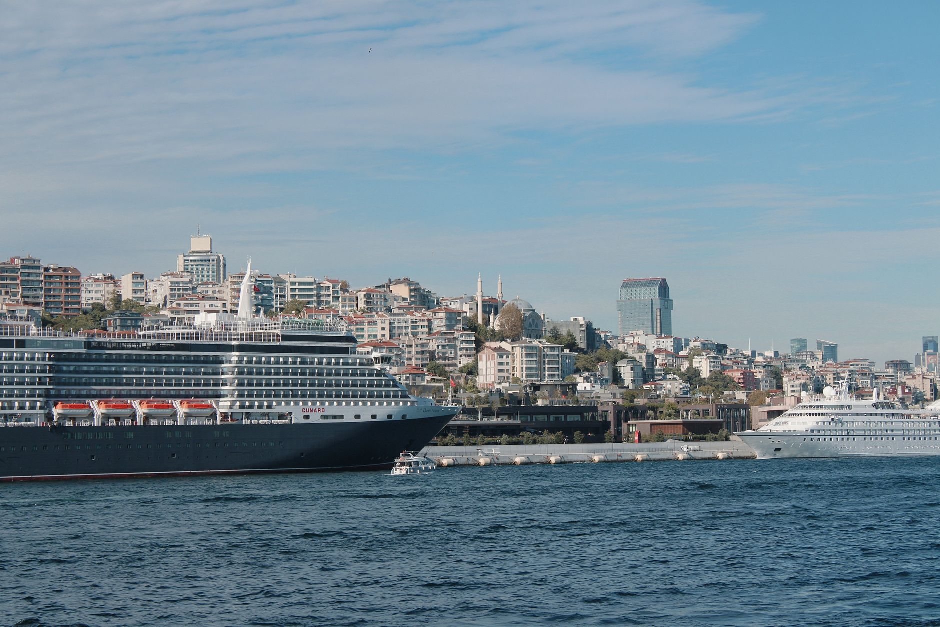 cruise ships docked in istanbul harbor on a sunny day