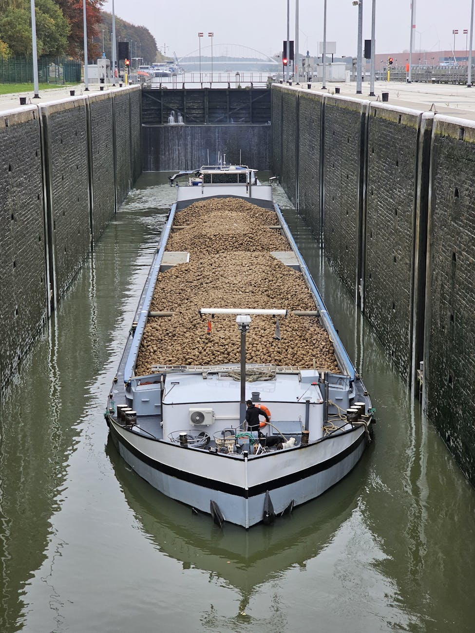 cargo ship navigating a lock in tessenderlo ham