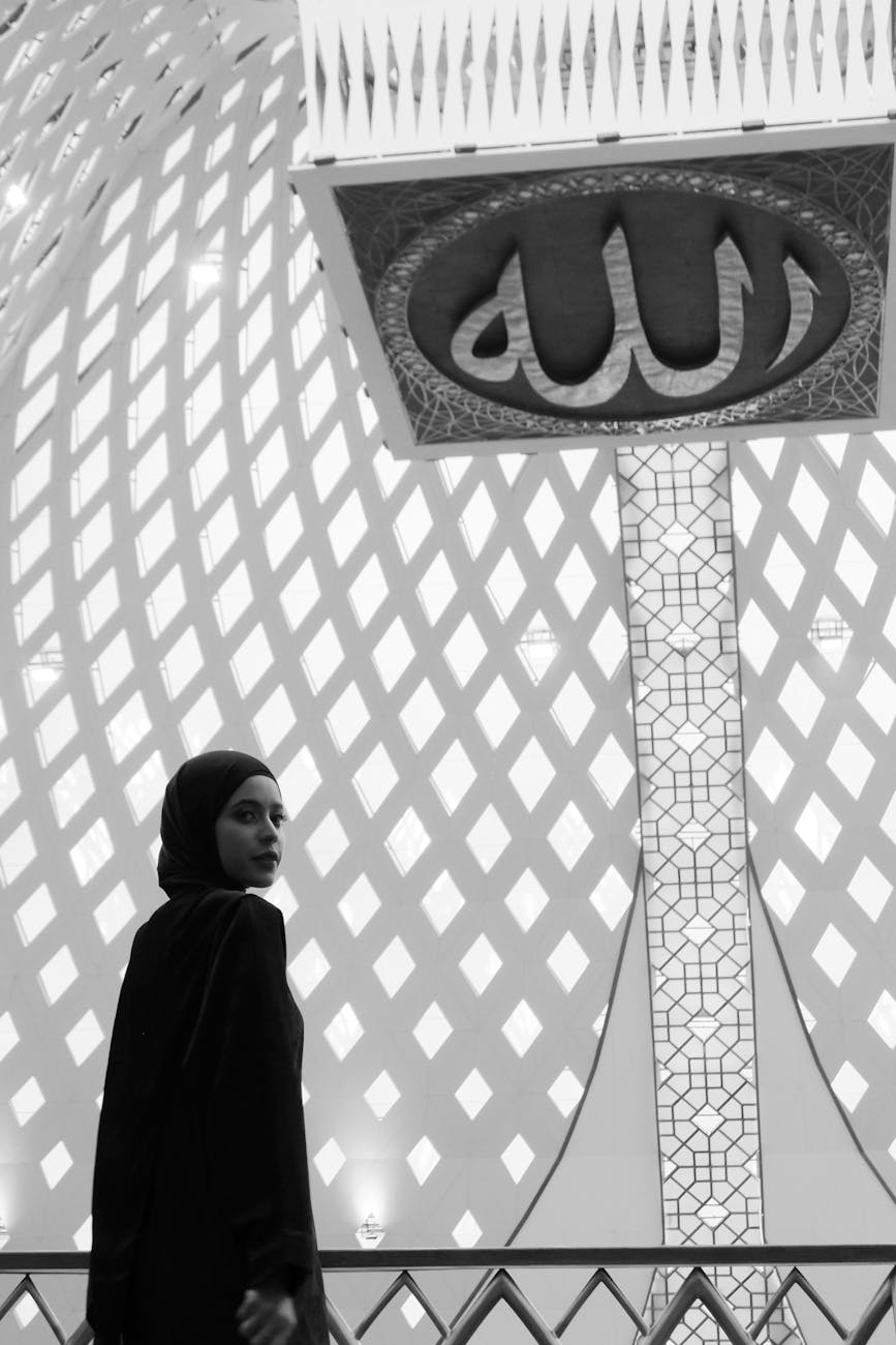 woman in hijab at al jabbar mosque interior
