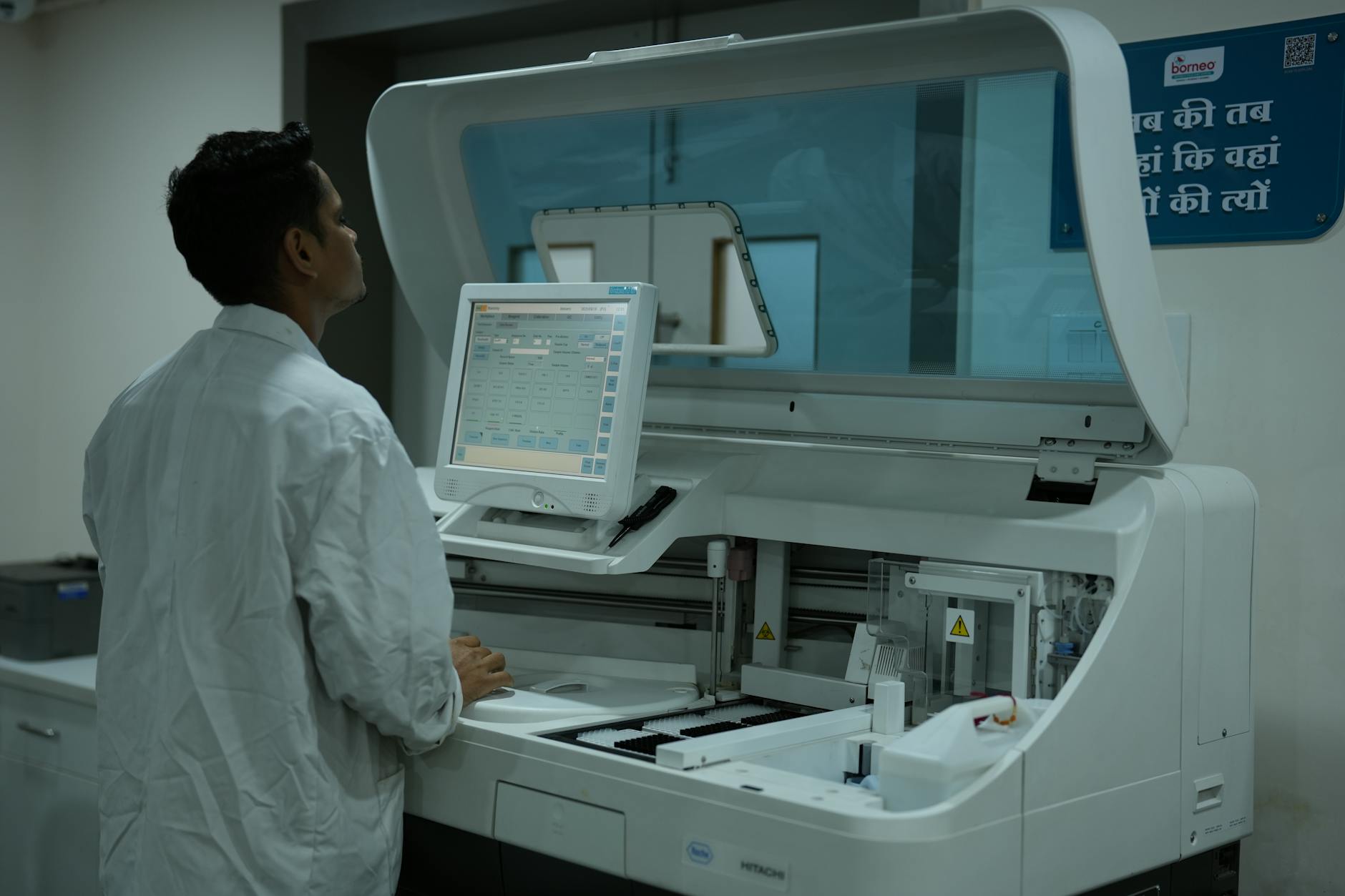 technician operating laboratory equipment