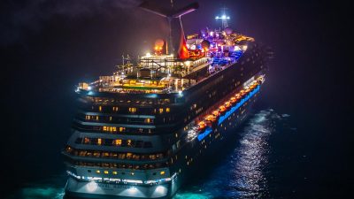 aerial view of illuminated cruise ship at night