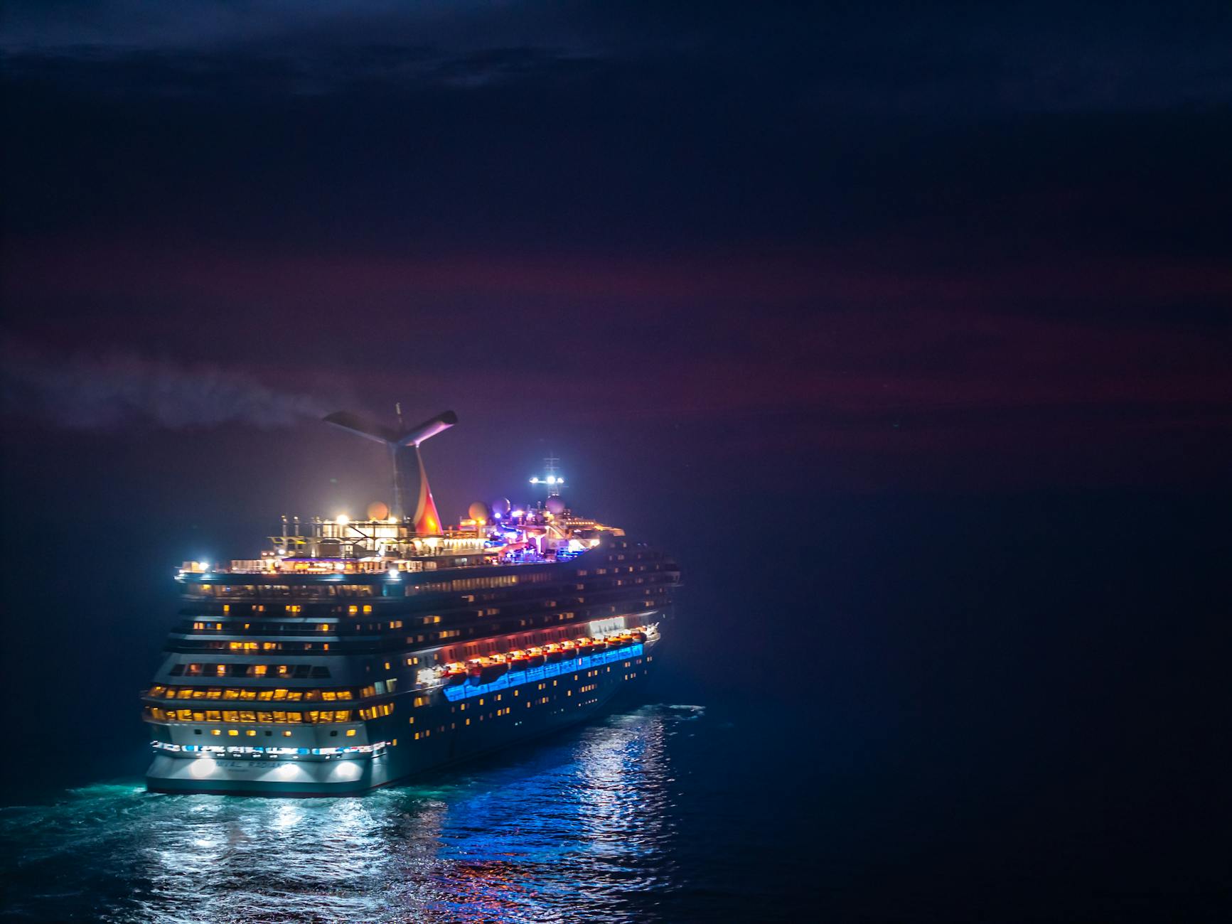 luxurious cruise ship sailing at night