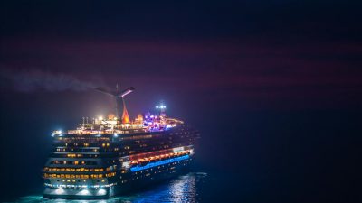 luxurious cruise ship sailing at night