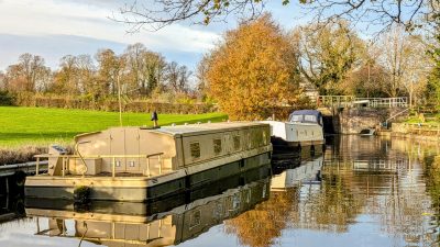 barges on canal in autumn england