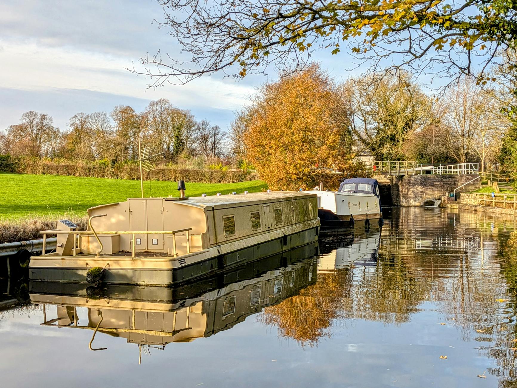barges on canal in autumn england