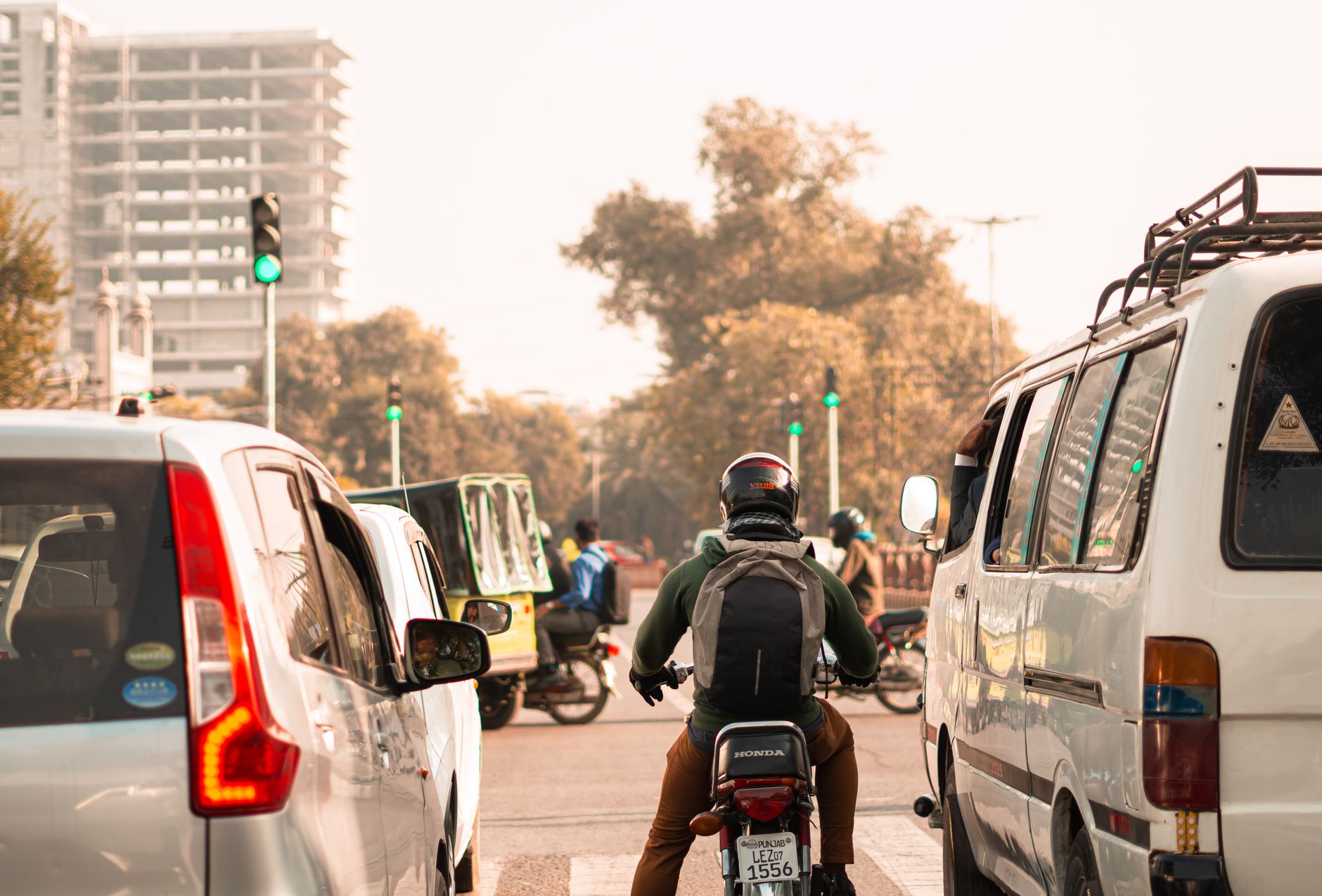 busy lahore intersection with traffic and motorists