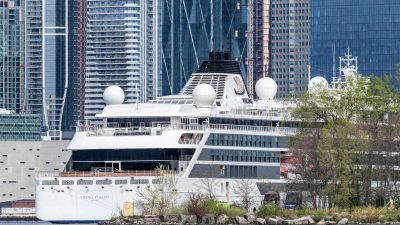 luxury cruise ship docked at urban port