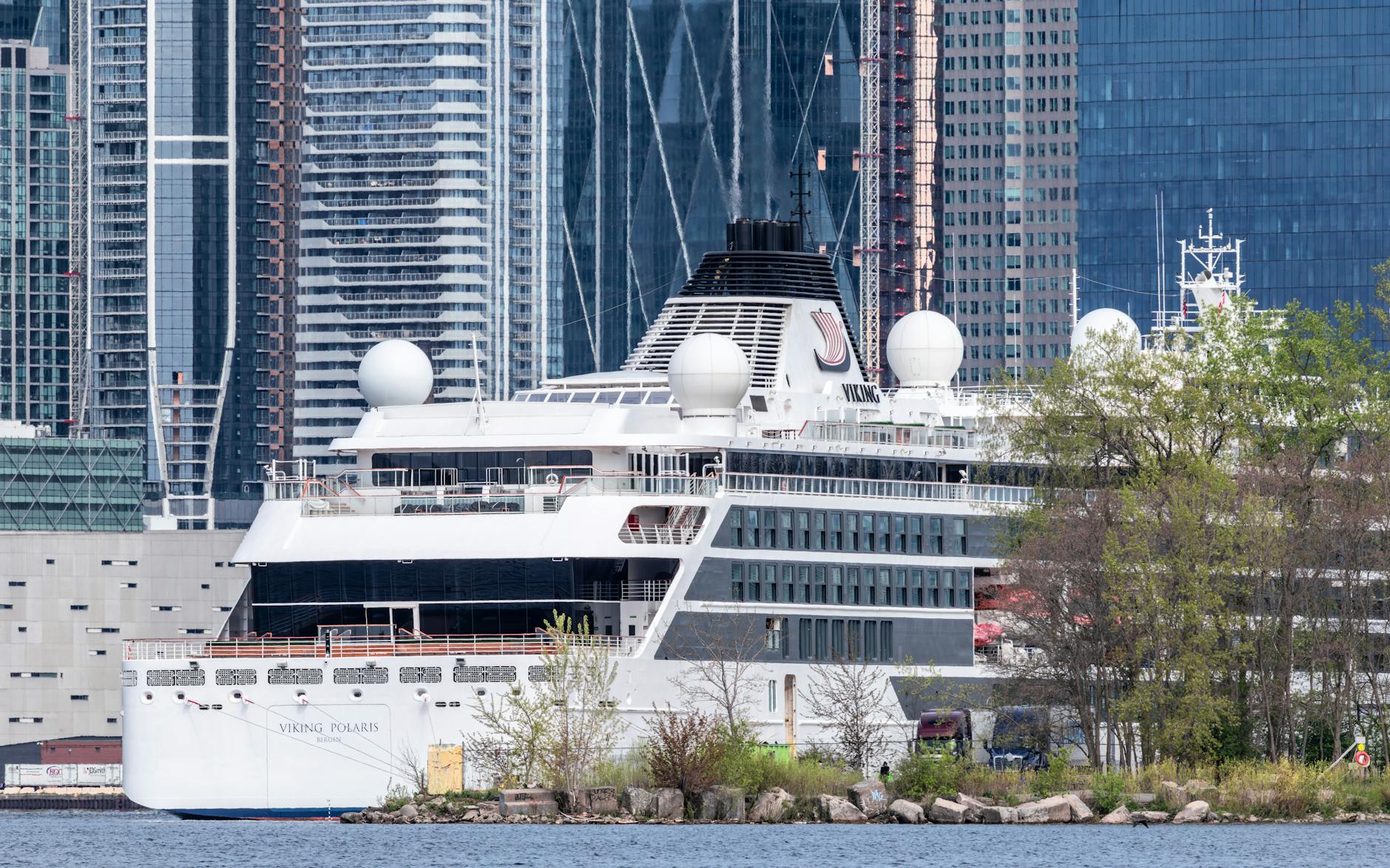 luxury cruise ship docked at urban port