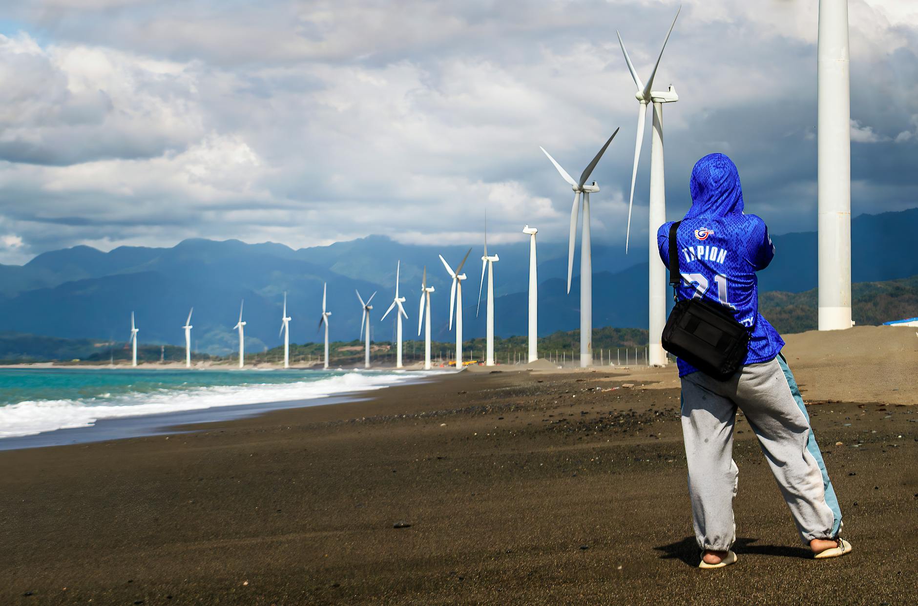photographer at bangui wind farm in the philippines