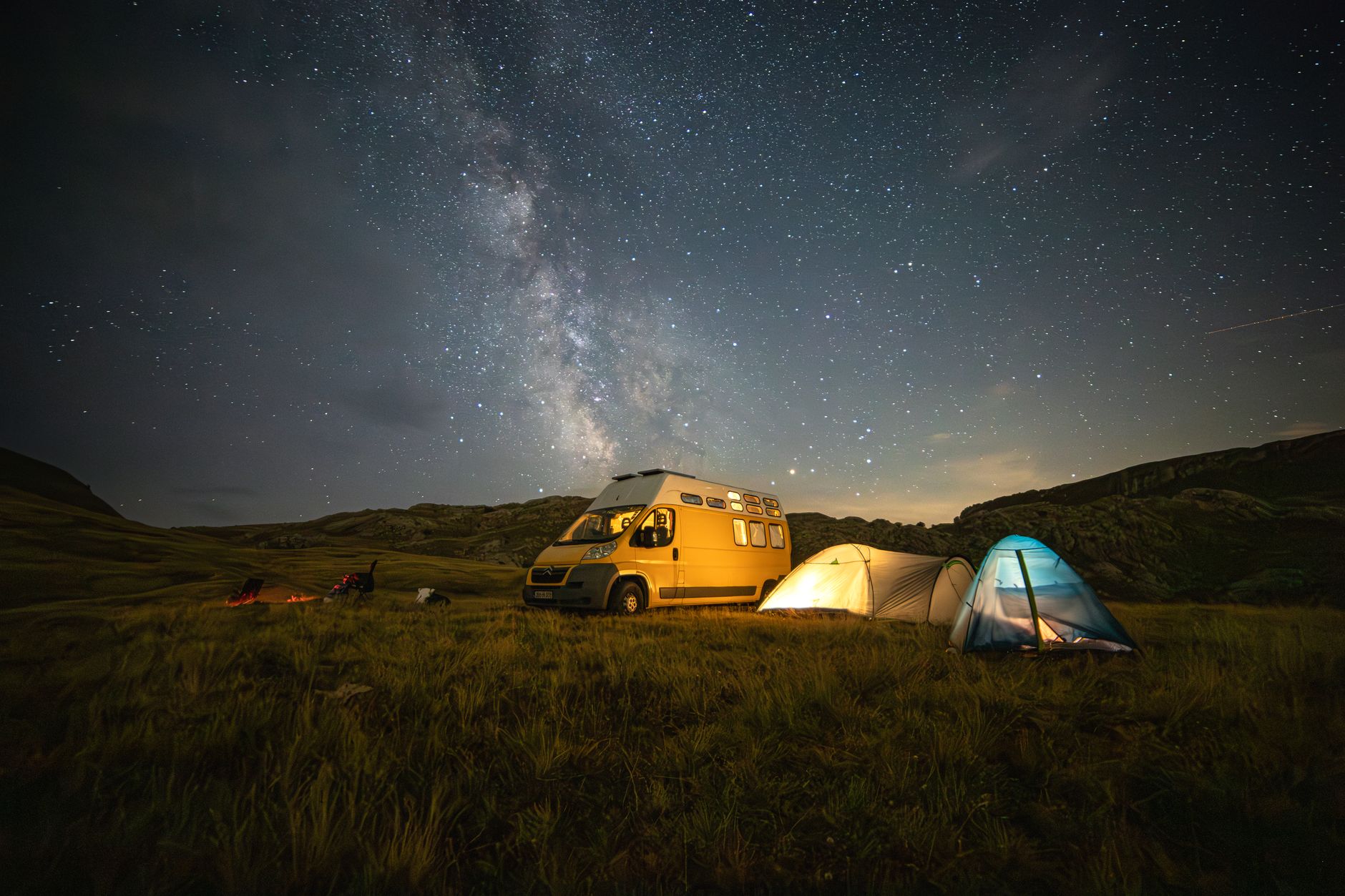 starry night camping adventure with van and tents