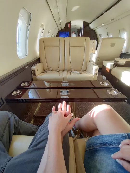 luxury private jet cabin interior with passengers
