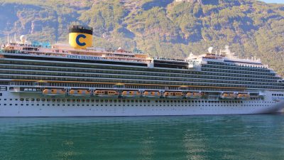 cruise ship in norwegian fjord landscape