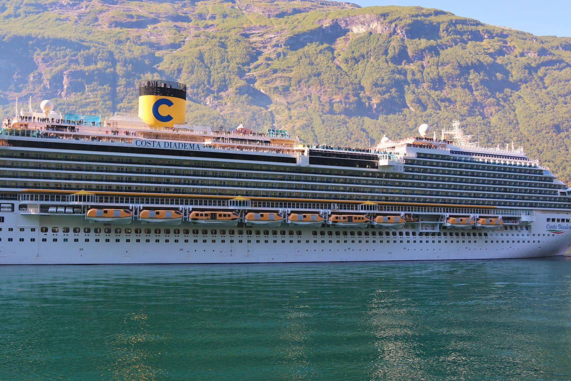 cruise ship in norwegian fjord landscape