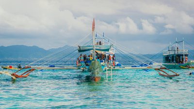 traditional outrigger boat in tropical waters