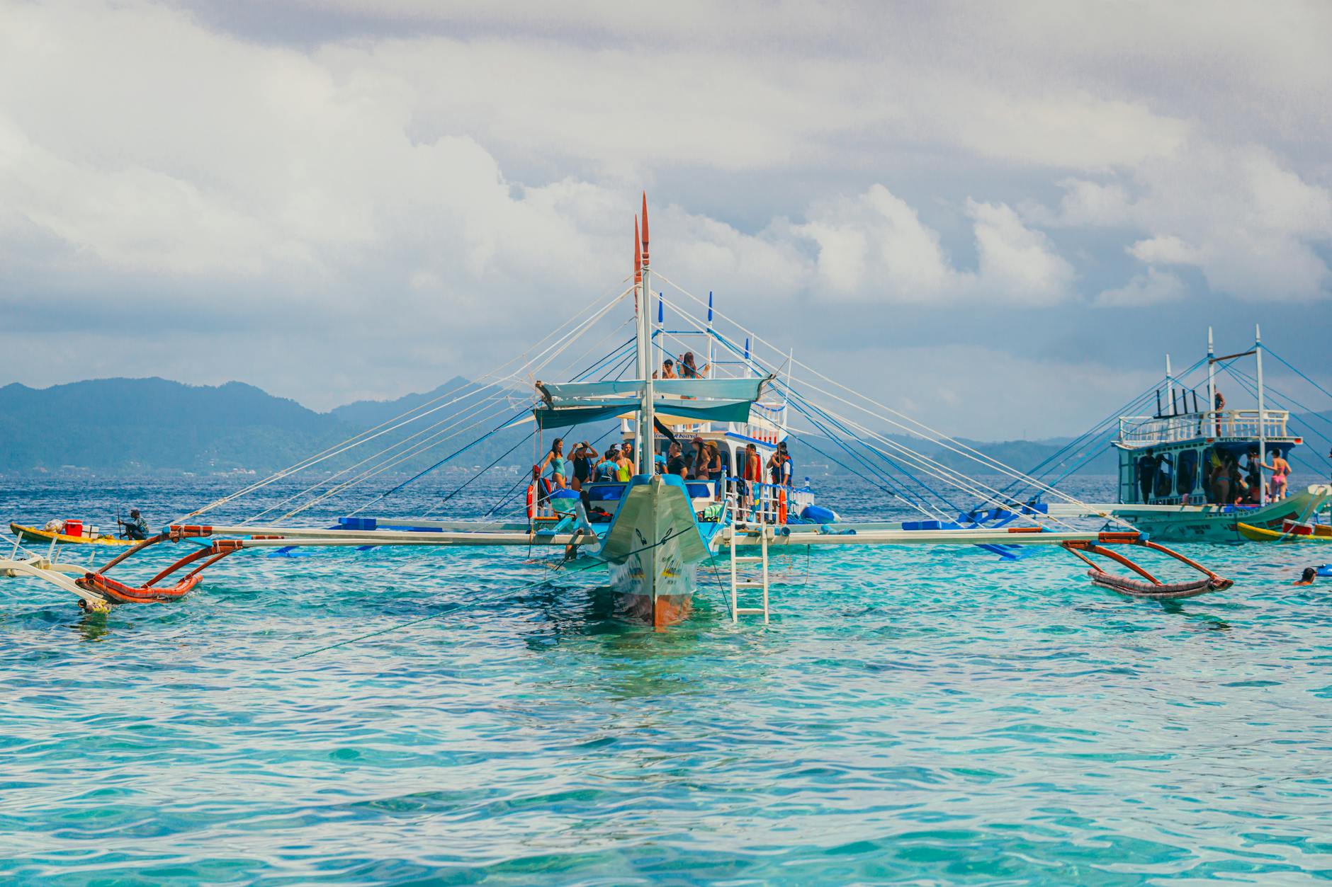 traditional outrigger boat in tropical waters
