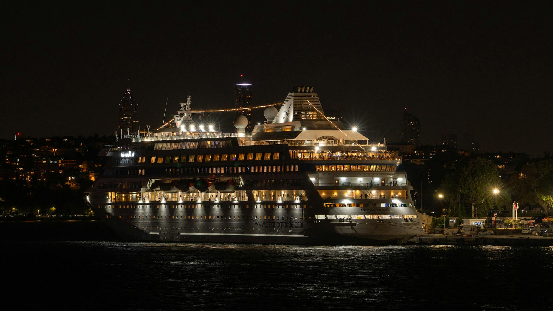 luxurious cruise ship docked at night scene