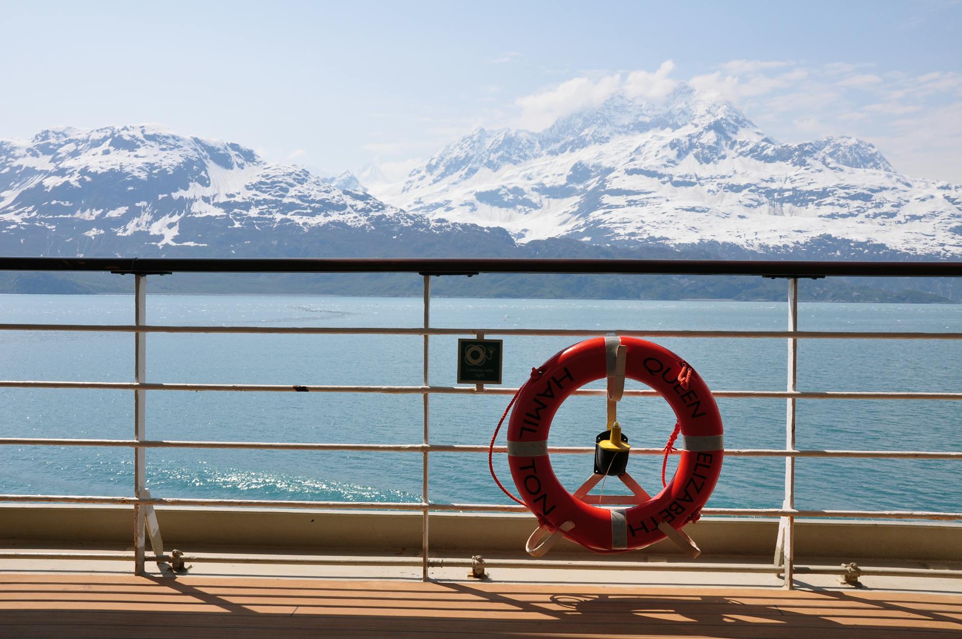 snowy mountains view from ship in alaska