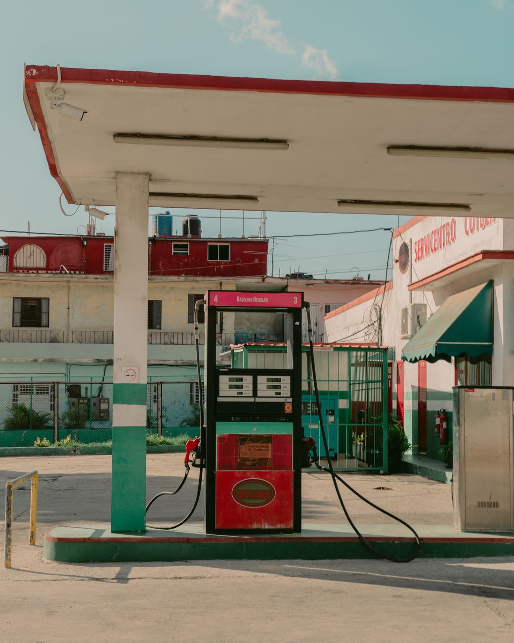vintage gas station in urban cuban setting
