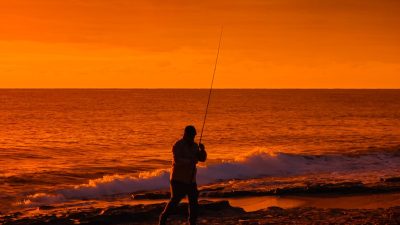 sunset fishing by the shore in antalya