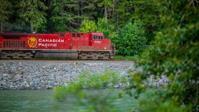 canadian pacific train in lush calgary landscape