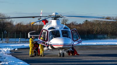 rescue helicopter on snowy runway in winter
