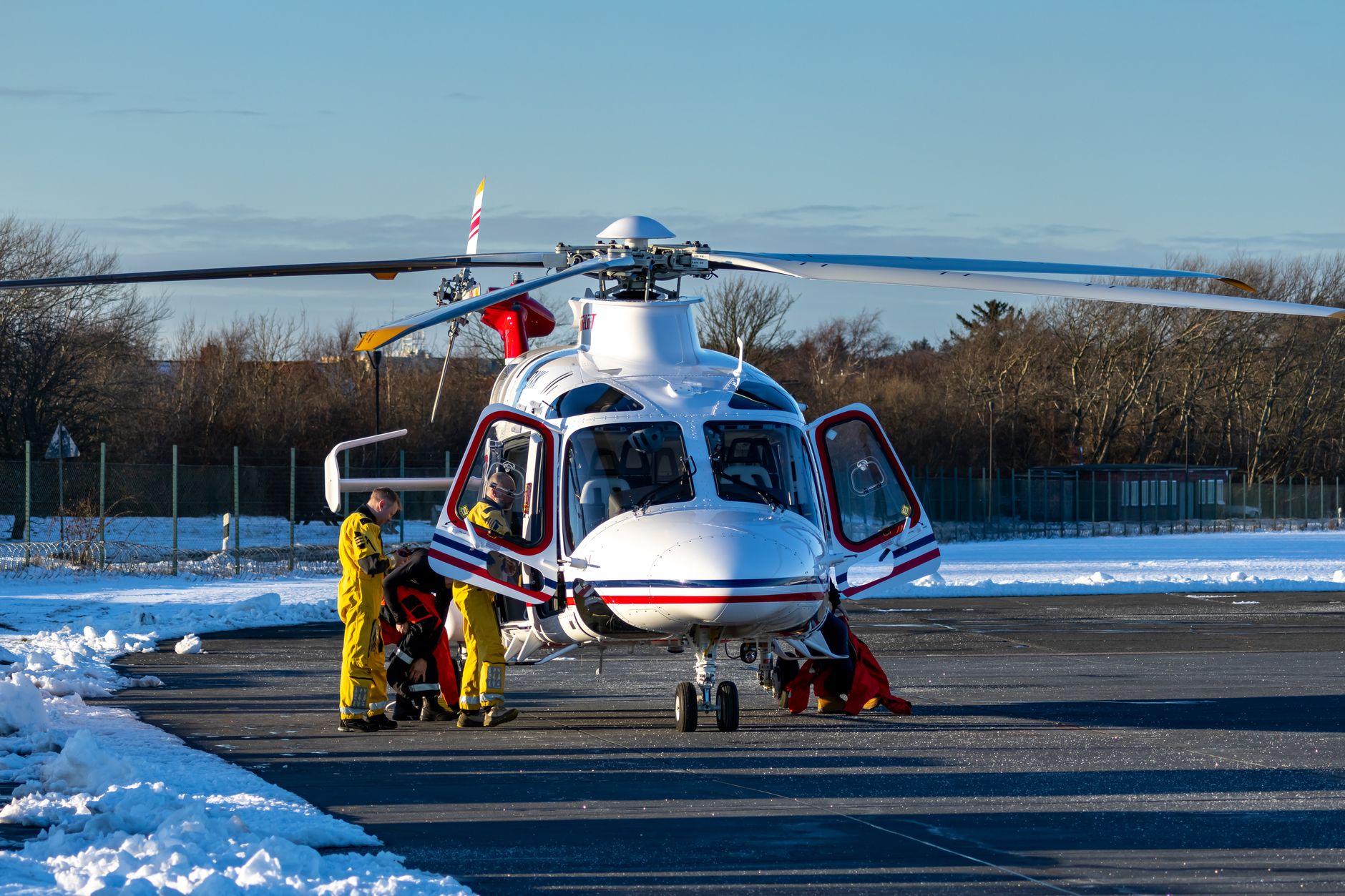 rescue helicopter on snowy runway in winter