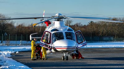 rescue helicopter on snowy runway in winter