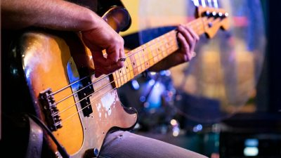 close up of a bass guitarist performing live