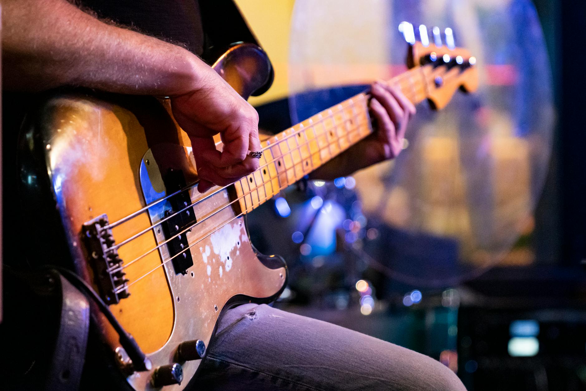 close up of a bass guitarist performing live