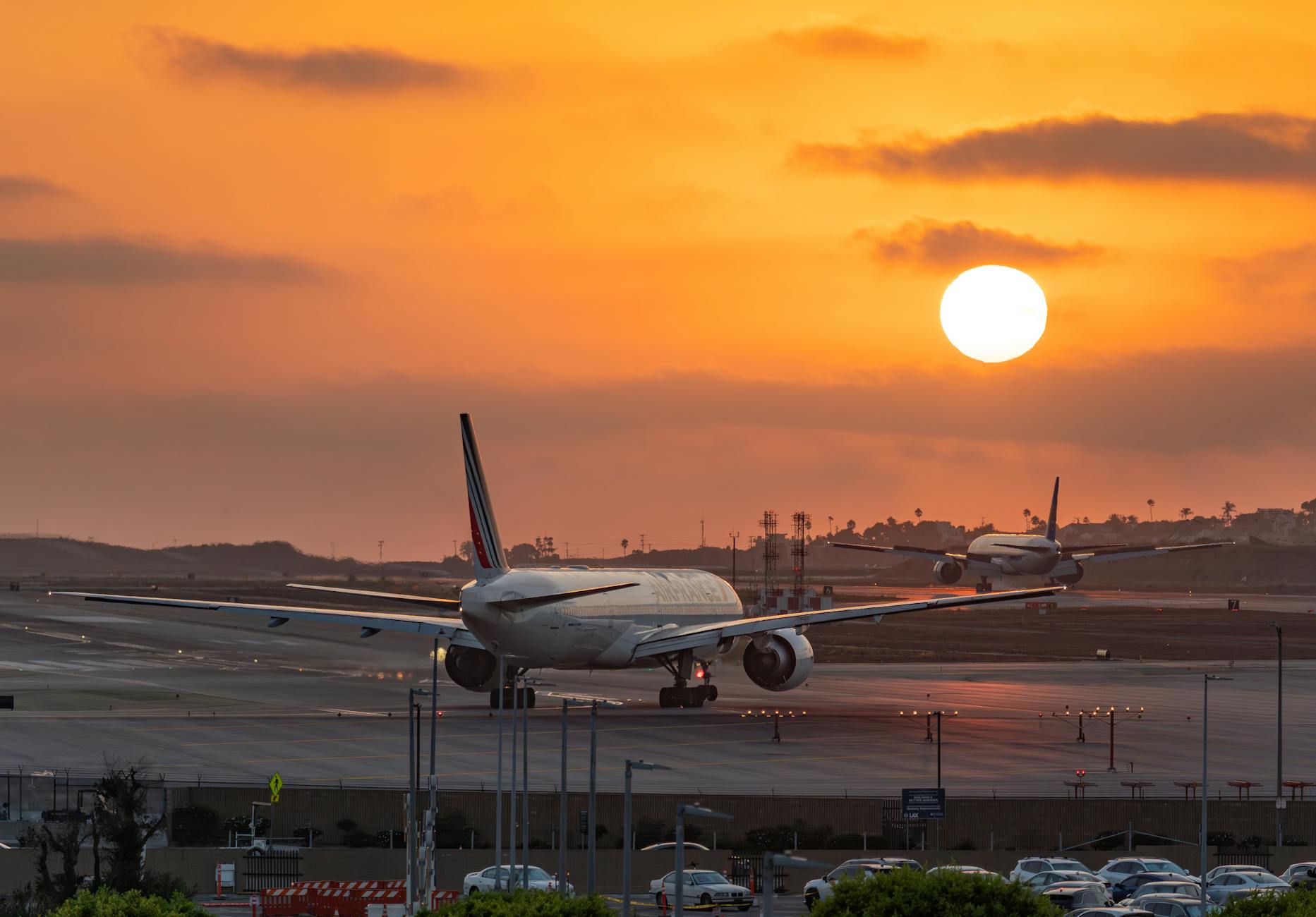 airplanes at los angeles airport during sunset