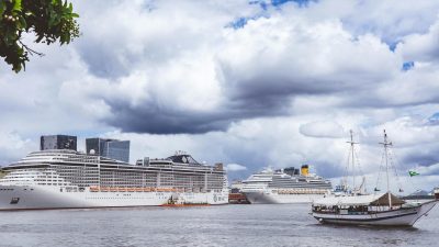 luxurious cruise ships docked in bustling harbor