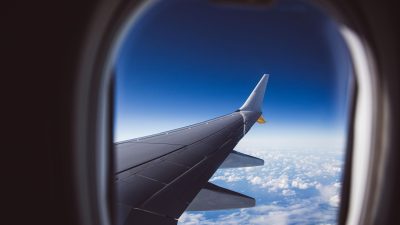 aerial view of clouds and airplane wing