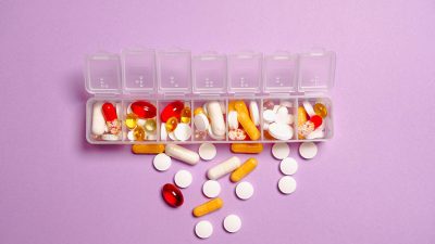photo medication pills on white plastic container