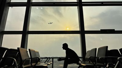 silhouette of man in kolkata airport terminal